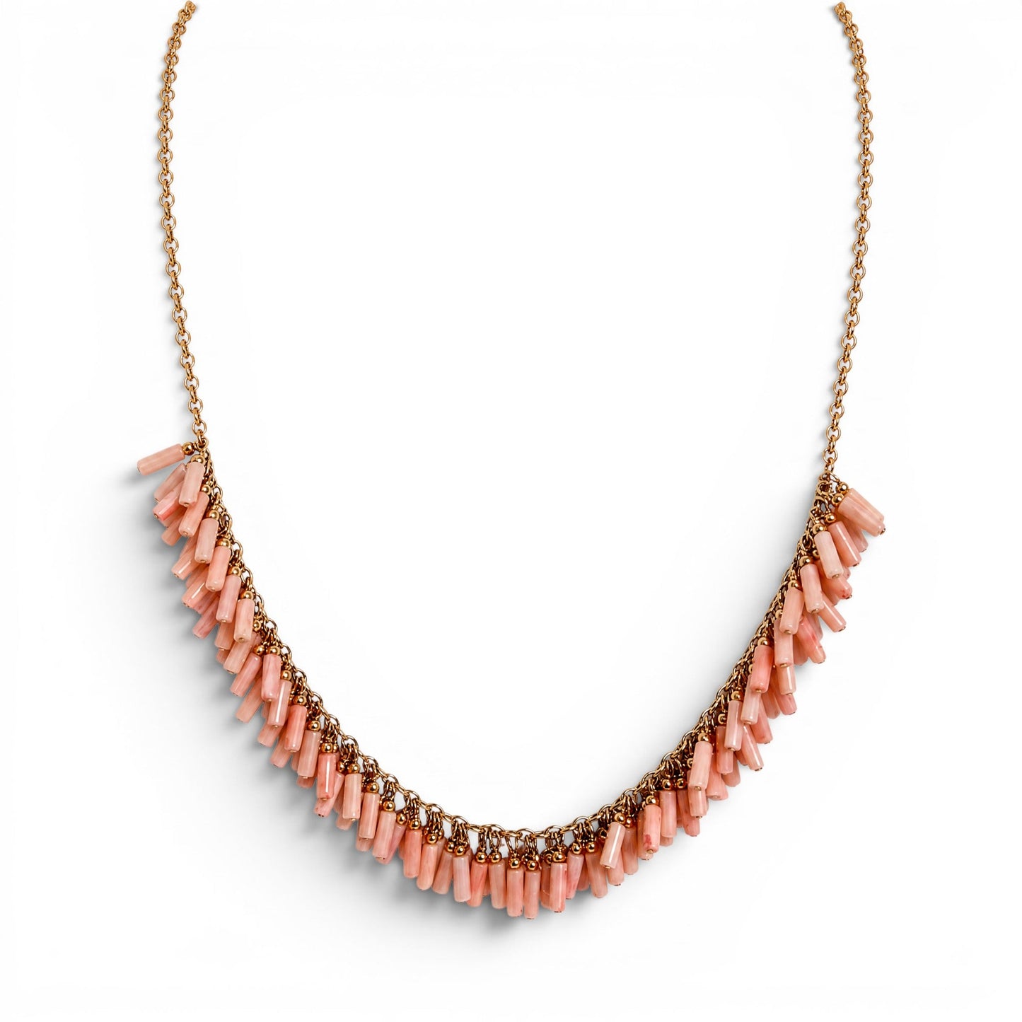 Trebor Style peach coral bead necklace with gold filled chain and fringe design on a white background.