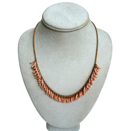 Trebor Style peach coral bead fringe necklace with gold filled chain on a display bust