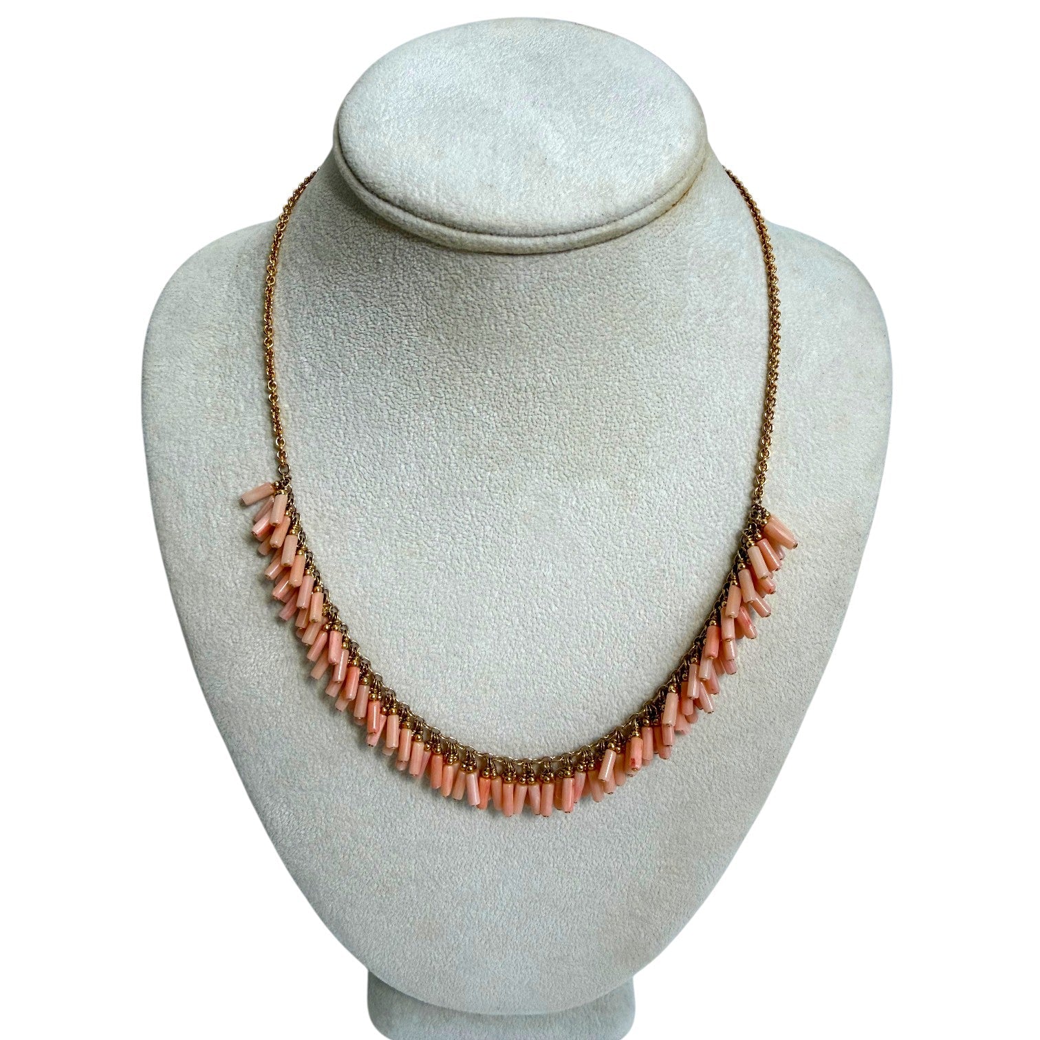 Trebor Style peach coral bead fringe necklace with gold filled chain on a display bust