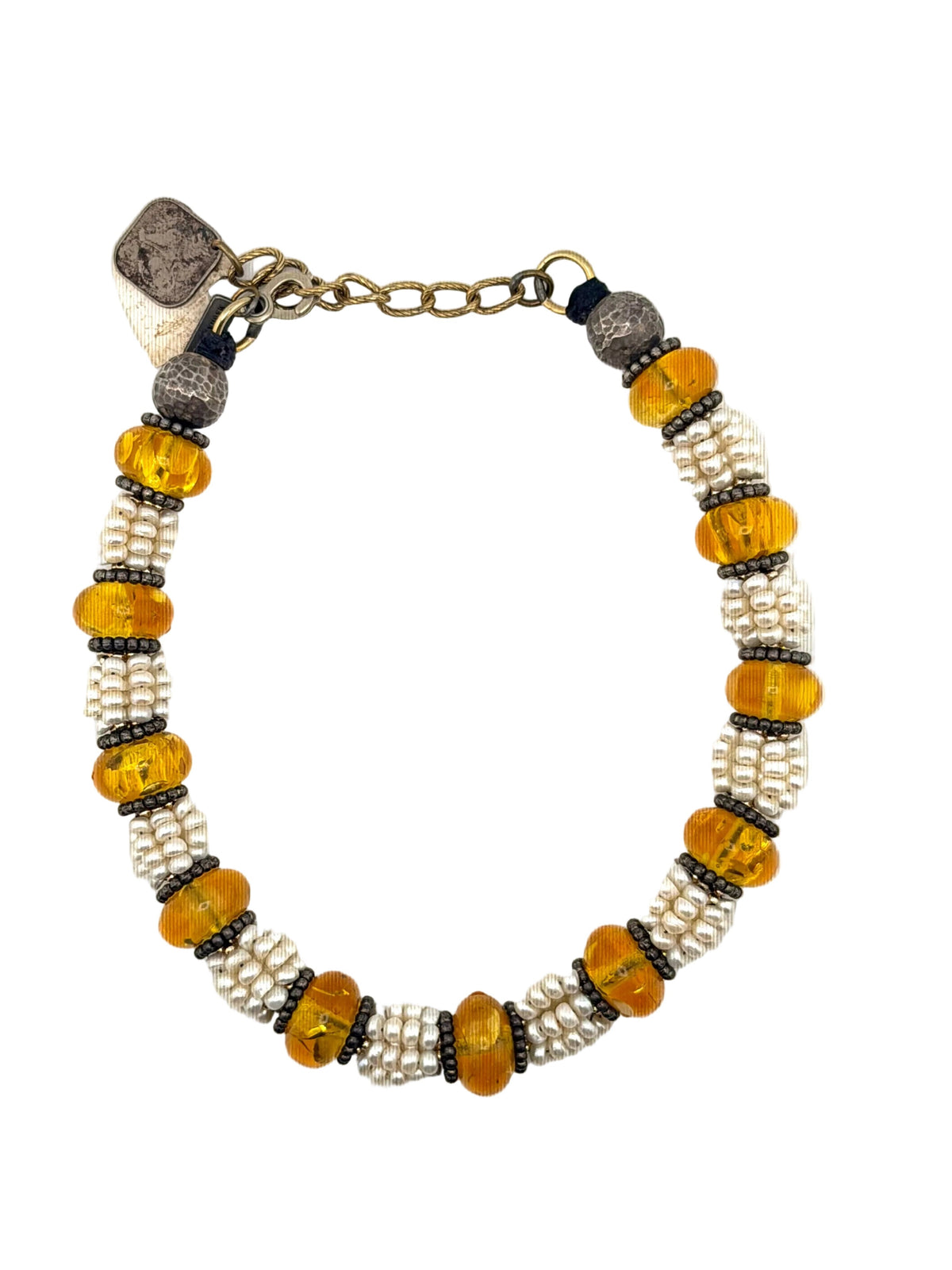 Trebor Style Masha Archer multi-strand necklace featuring freshwater pearls, Baltic amber, and hammered silver accents.