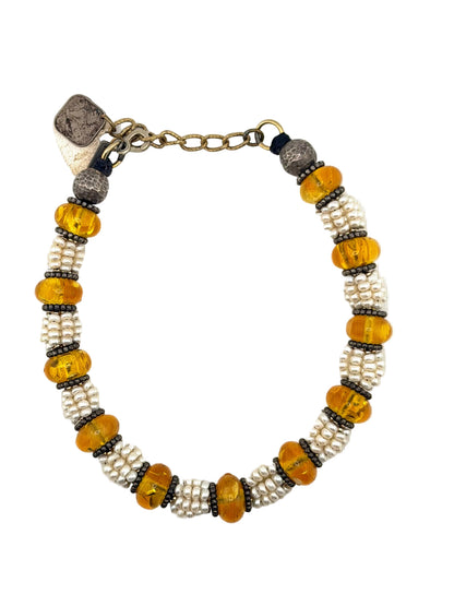 Trebor Style Masha Archer multi-strand necklace featuring freshwater pearls, Baltic amber, and hammered silver accents.