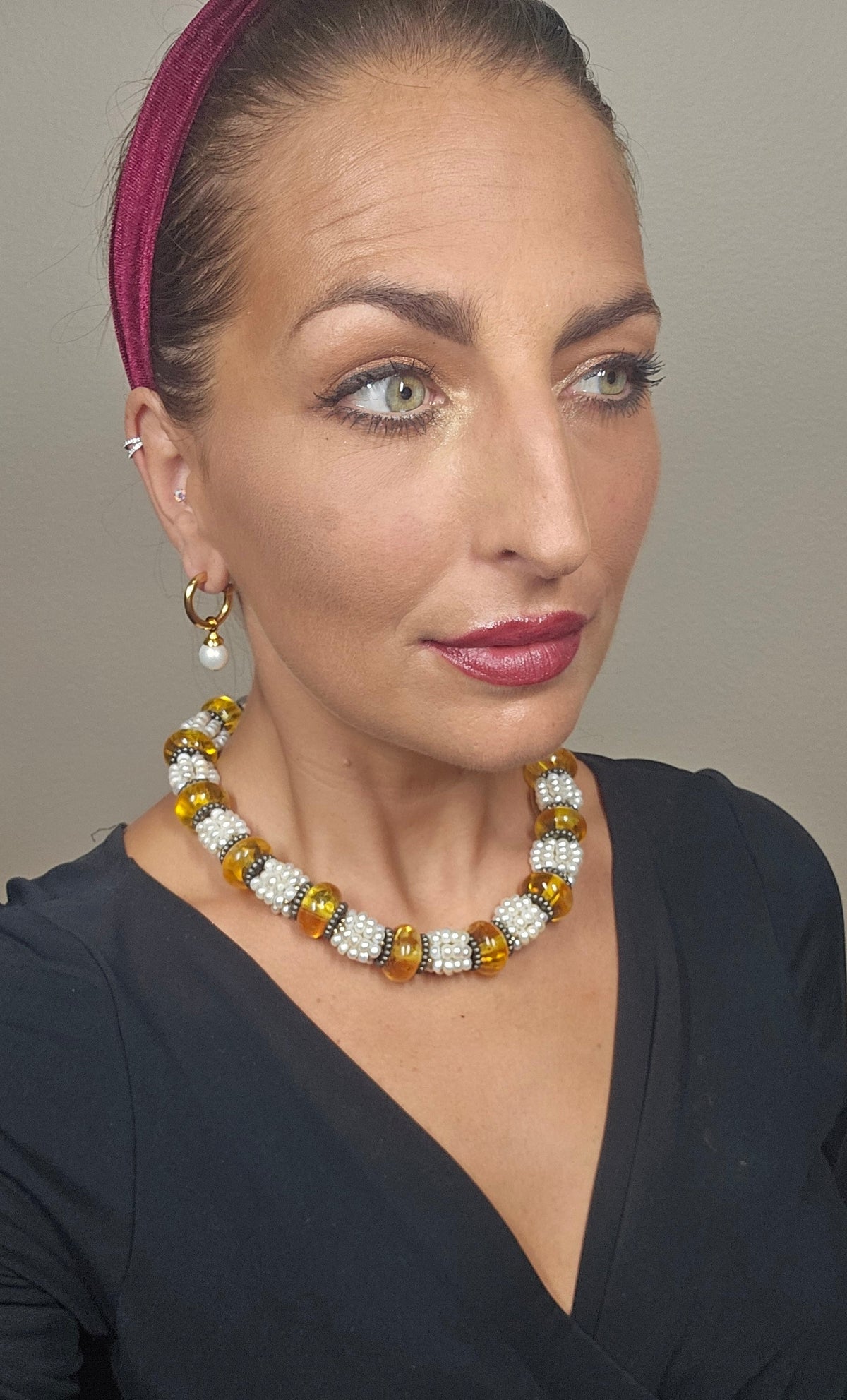 Trebor Style Masha Archer necklace featuring freshwater pearls and Baltic amber rondelles with hammered silver accents.