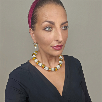 Trebor Style Masha Archer necklace featuring eight strands of freshwater pearls, Baltic amber, and hammered silver.