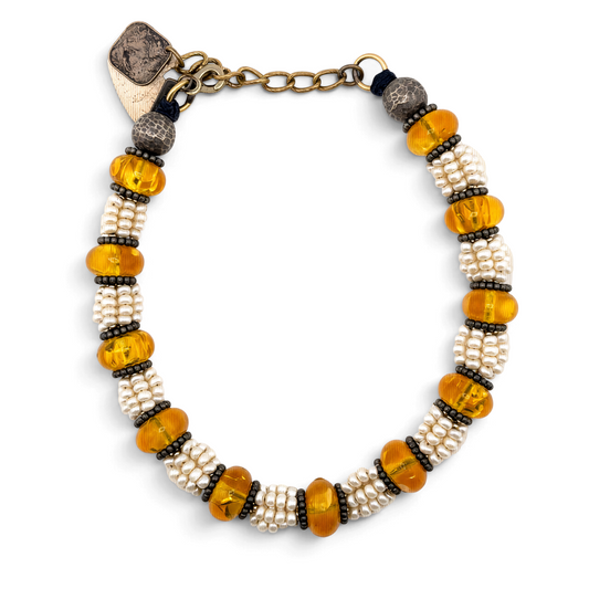 Trebor Style Masha Archer necklace featuring eight strands of freshwater pearls, Baltic amber, and hammered silver.
