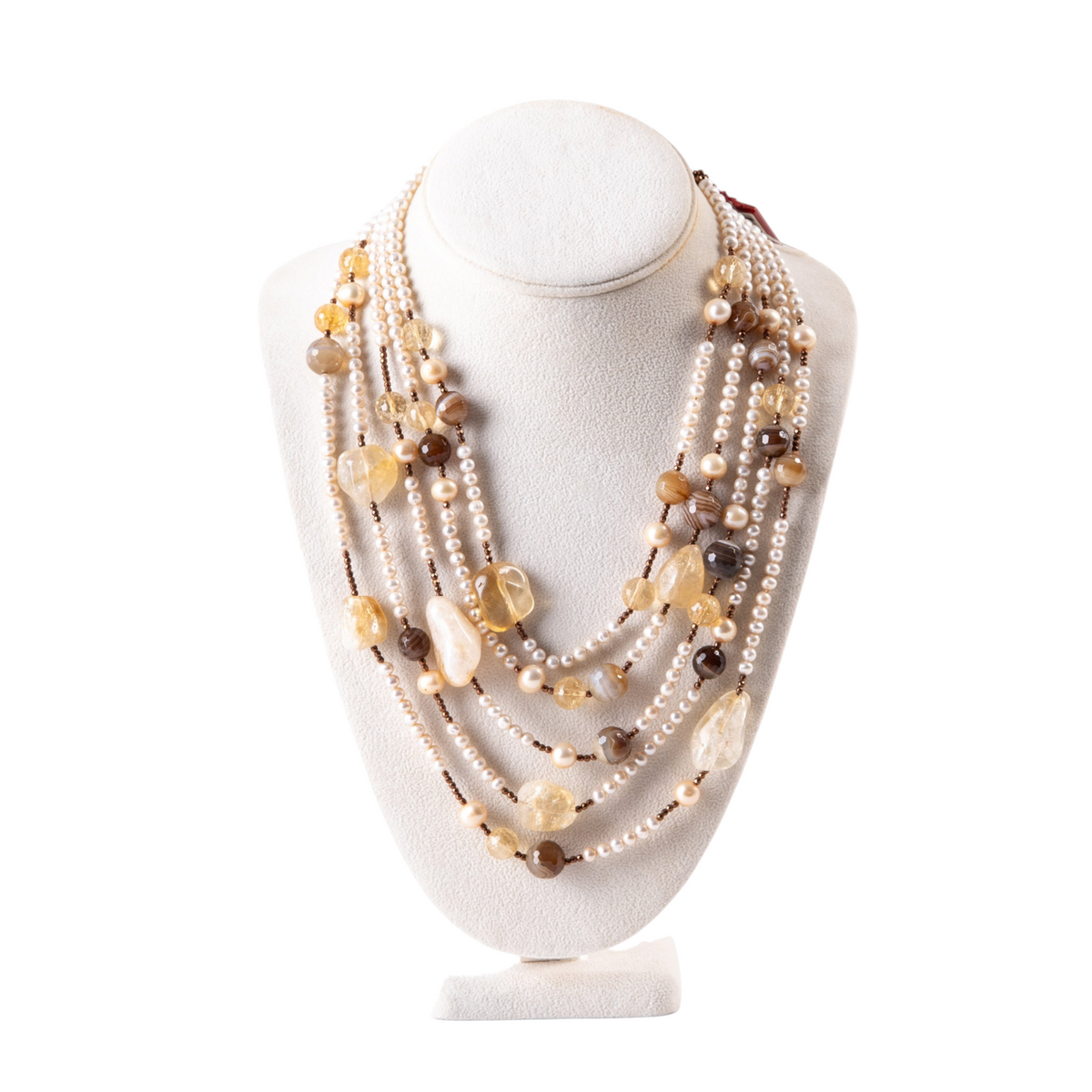 Trebor Style multi-strand necklace featuring cream pearls, brown agate, golden citrine, and hematite on 18k gold.