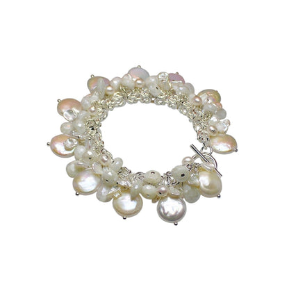 Trebor Style sterling silver charm bracelet featuring white coin pearls, keshi pearls, and sparkling white sapphires.