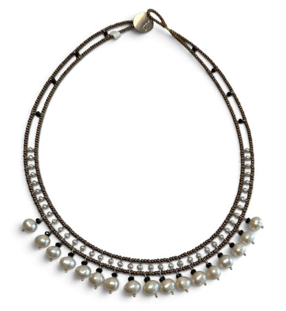 Trebor Style handmade necklace featuring white water pearls, black tourmaline, and Murano glass beads on steel wire.