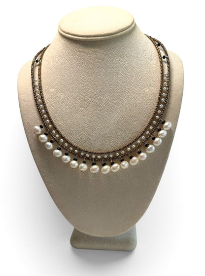 Trebor Style handmade necklace featuring white water pearls, black tourmaline, and Murano glass beads on steel wire.