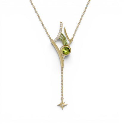 Trebor Style Antares necklace featuring a green peridot, tsavorite garnets, and diamonds on a gold star drop pendant.