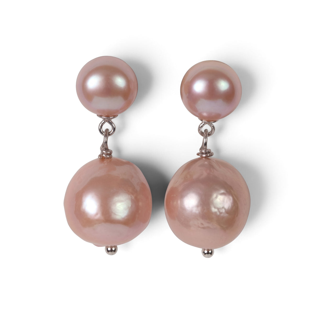 Trebor Style Kate earrings featuring two stacked pink pearls on silver-plated sterling silver drop posts.