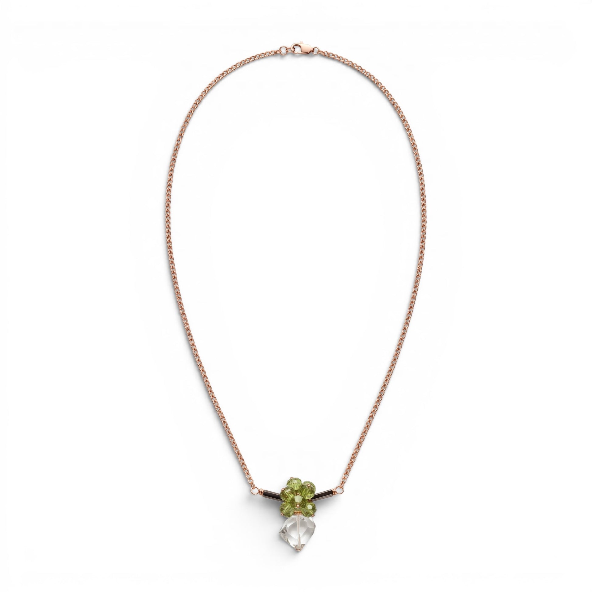 Trebor Style bar necklace featuring green peridot, dark tourmaline, and a praisiolite pendant on a gold wheat chain.