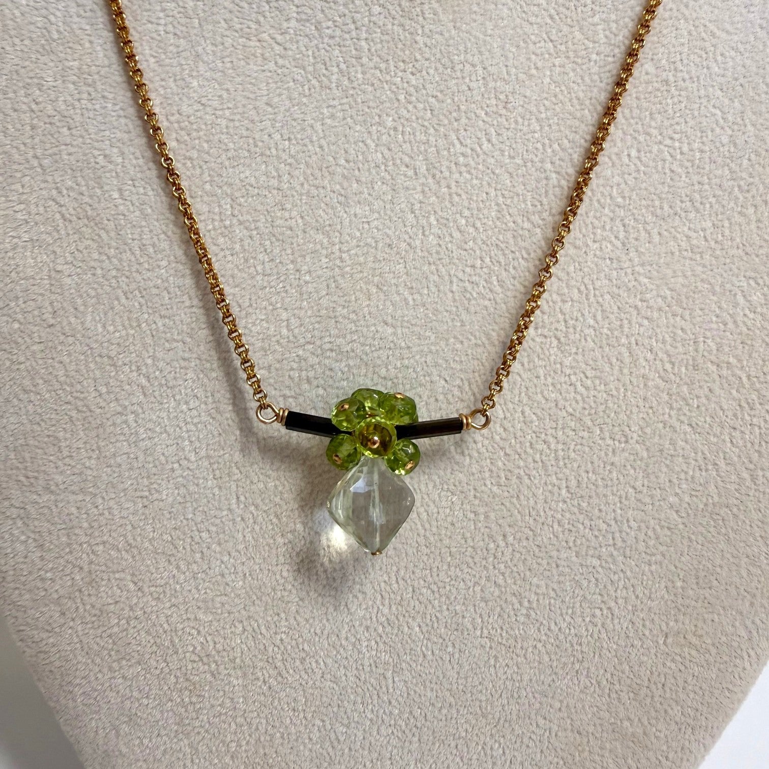 Trebor Style bar necklace featuring a dark green tourmaline bar, peridot cluster, and a dangling praisiolite pendant.