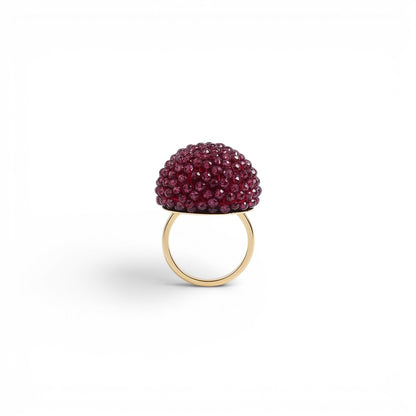 Trebor Style cocktail ring featuring a sphere of faceted purple garnet beads set on an 18k yellow gold band.
