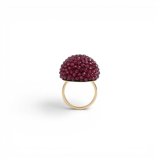 Trebor Style cocktail ring featuring a sphere of faceted purple garnet beads set on an 18k yellow gold band.