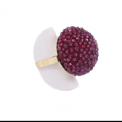 Trebor Style cocktail ring featuring a large sphere of faceted purple garnet beads on an 18k yellow gold band.