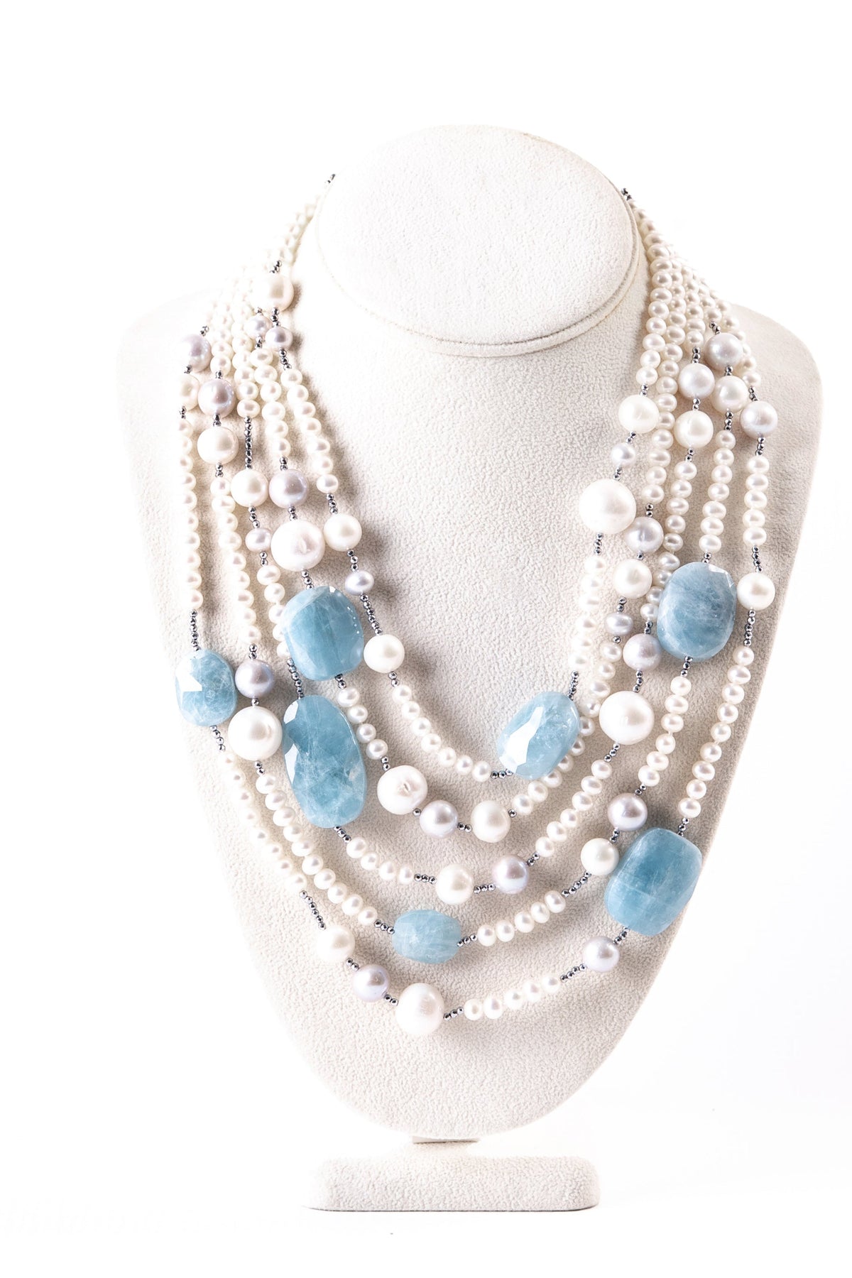 Trebor Style Rajola multi-strand necklace featuring white and gray freshwater pearls, aquamarine, and hematite accents.