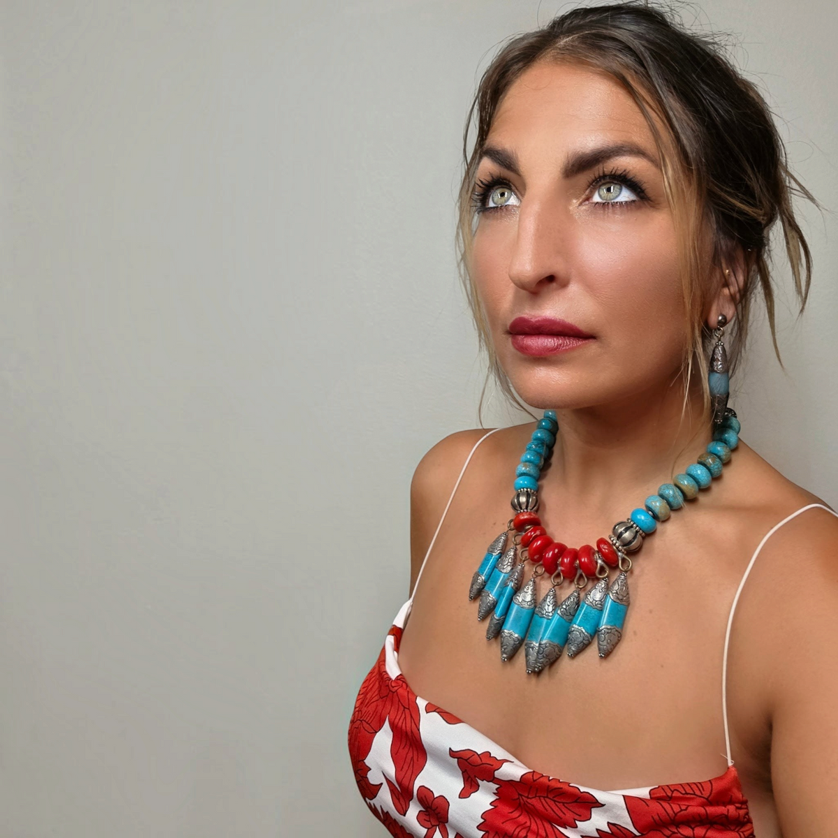 Trebor Style Masha Archer statement necklace with red coral, turquoise, and silver animal-themed fringe pendants.