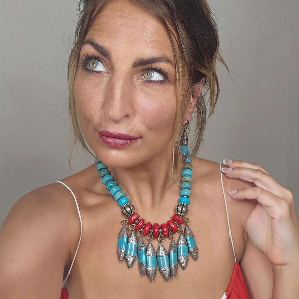 Trebor Style Masha Archer statement necklace with red coral, turquoise rondelles, and silver Tibetan animal pendants.