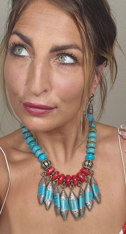 Trebor Style Masha Archer statement necklace featuring red baroque coral, turquoise rondelles, and Tibetan silver.