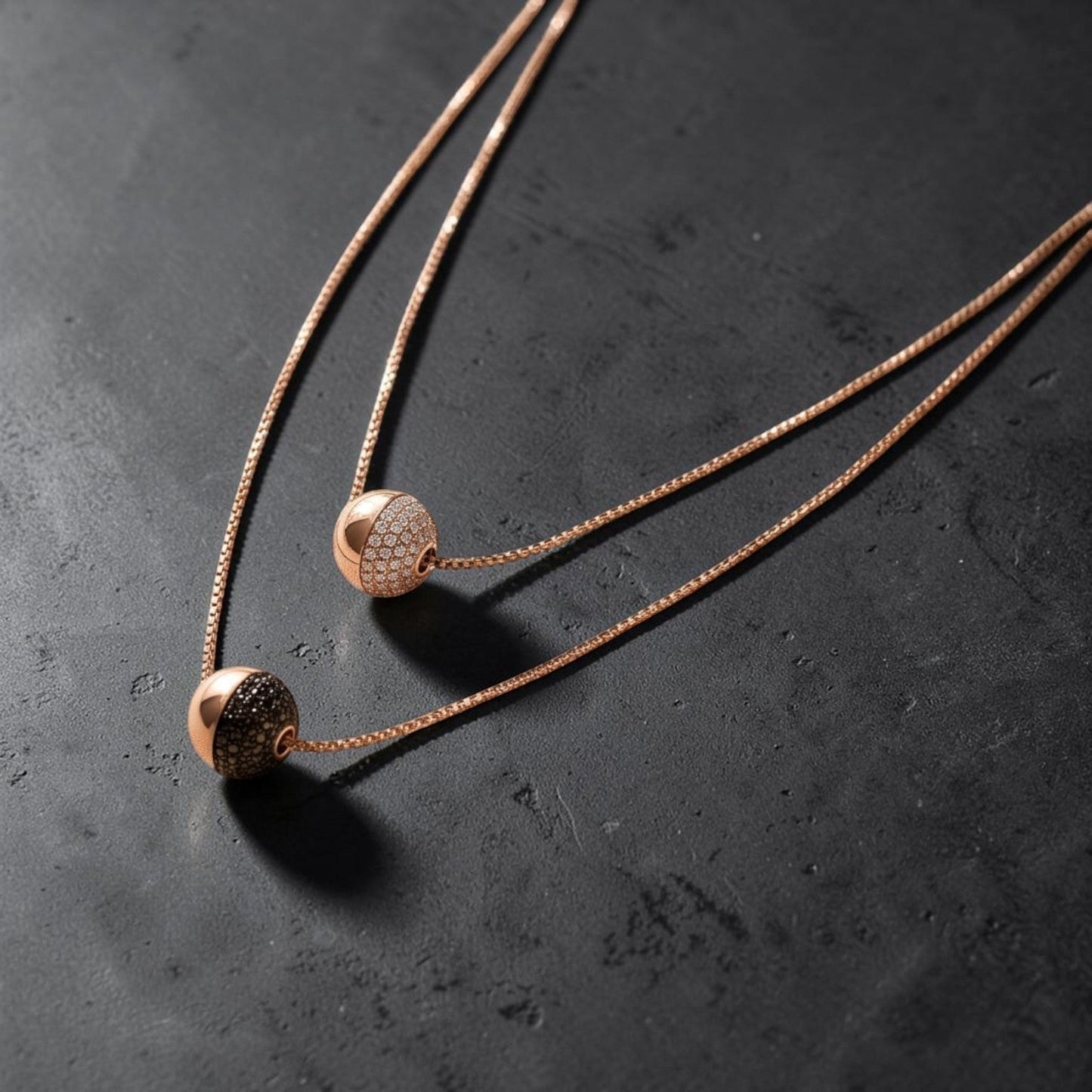 Trebor Style Bronzallure rose gold layered necklace with white cubic zirconia and black spinel pavé spheres
