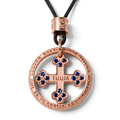 Trebor Style TUUM Flore Lux rose gold pendant necklace featuring a cross motif with blue sapphires on a black cord.