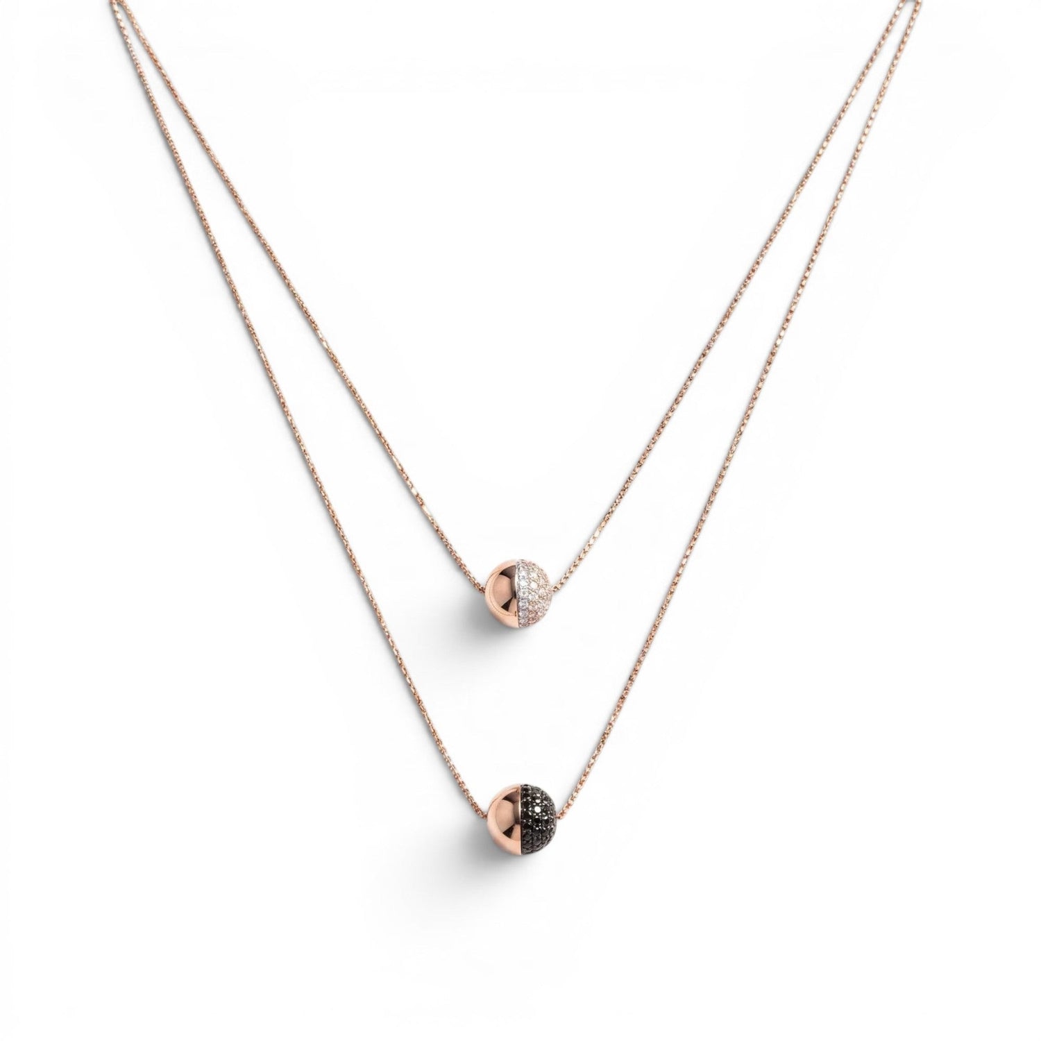 Trebor Style rose gold plated double-strand necklace with white and black spineli gemstone sphere pendants on a delicate chain, handmade in Italy by Bronzallure