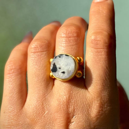 Trebor Style 16mm round moonstone ring with a chunky gold filled adjustable band worn on a finger
