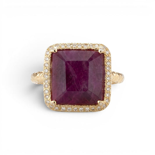 Trebor Style 14k gold cocktail ring featuring a large emerald-cut African ruby surrounded by a white diamond halo.