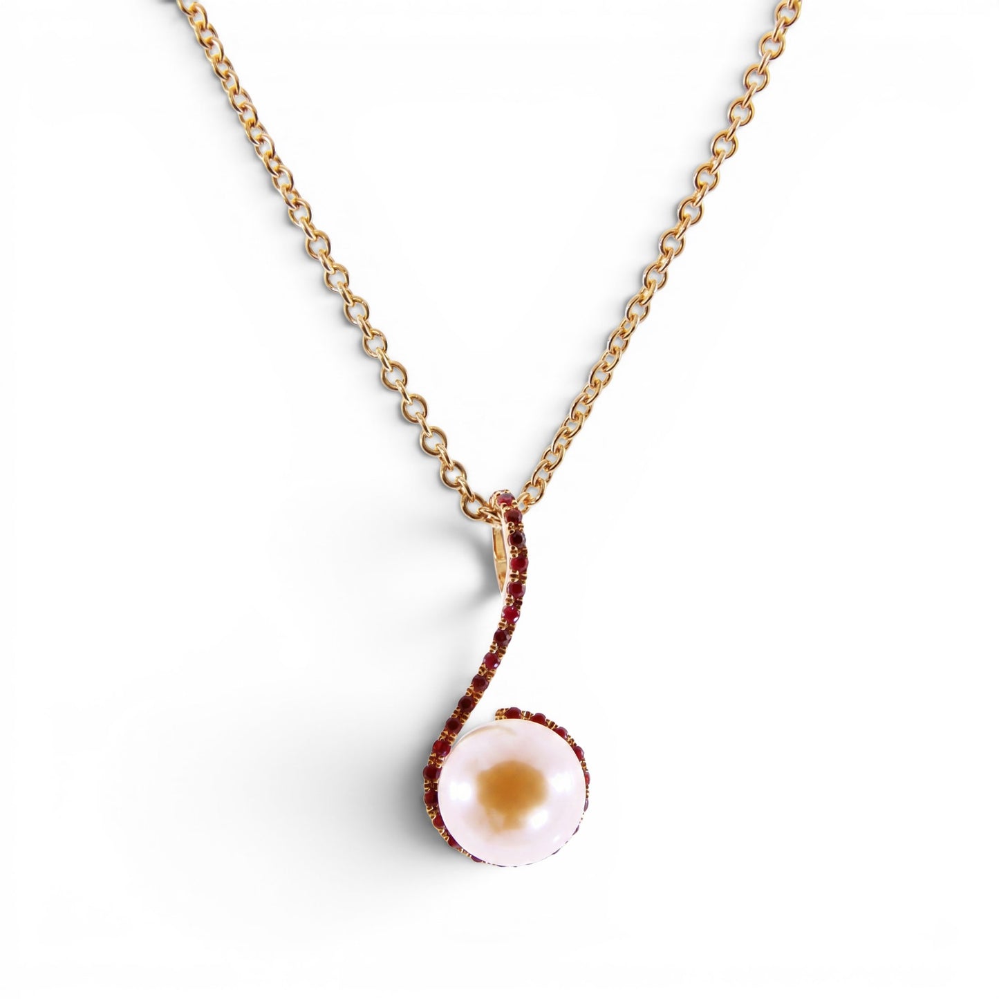 Trebor Style 18k yellow gold pendant necklace featuring a 9mm pink cultured pearl accented by sparkling red rubies.