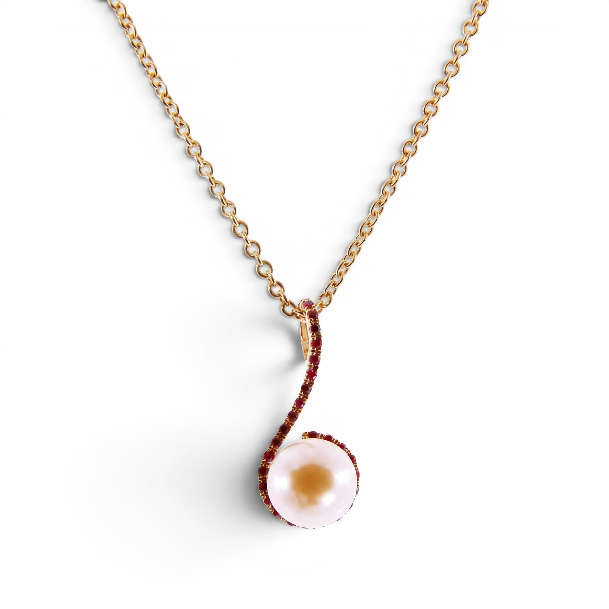 Trebor Style 18k yellow gold pendant necklace featuring a 9mm pink cultured pearl accented by sparkling red rubies.