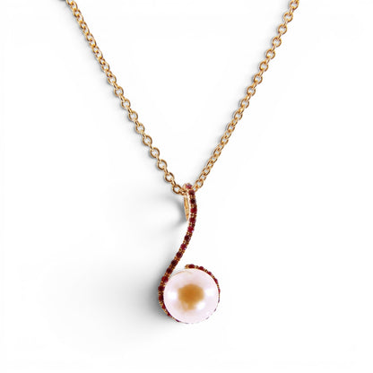 Trebor Style 18k yellow gold pendant necklace featuring a 9mm pink cultured pearl accented by sparkling red rubies.