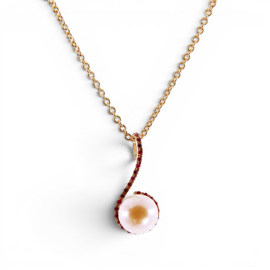 Trebor Style 18k yellow gold pendant necklace featuring a 9mm pink cultured pearl accented by sparkling red rubies.