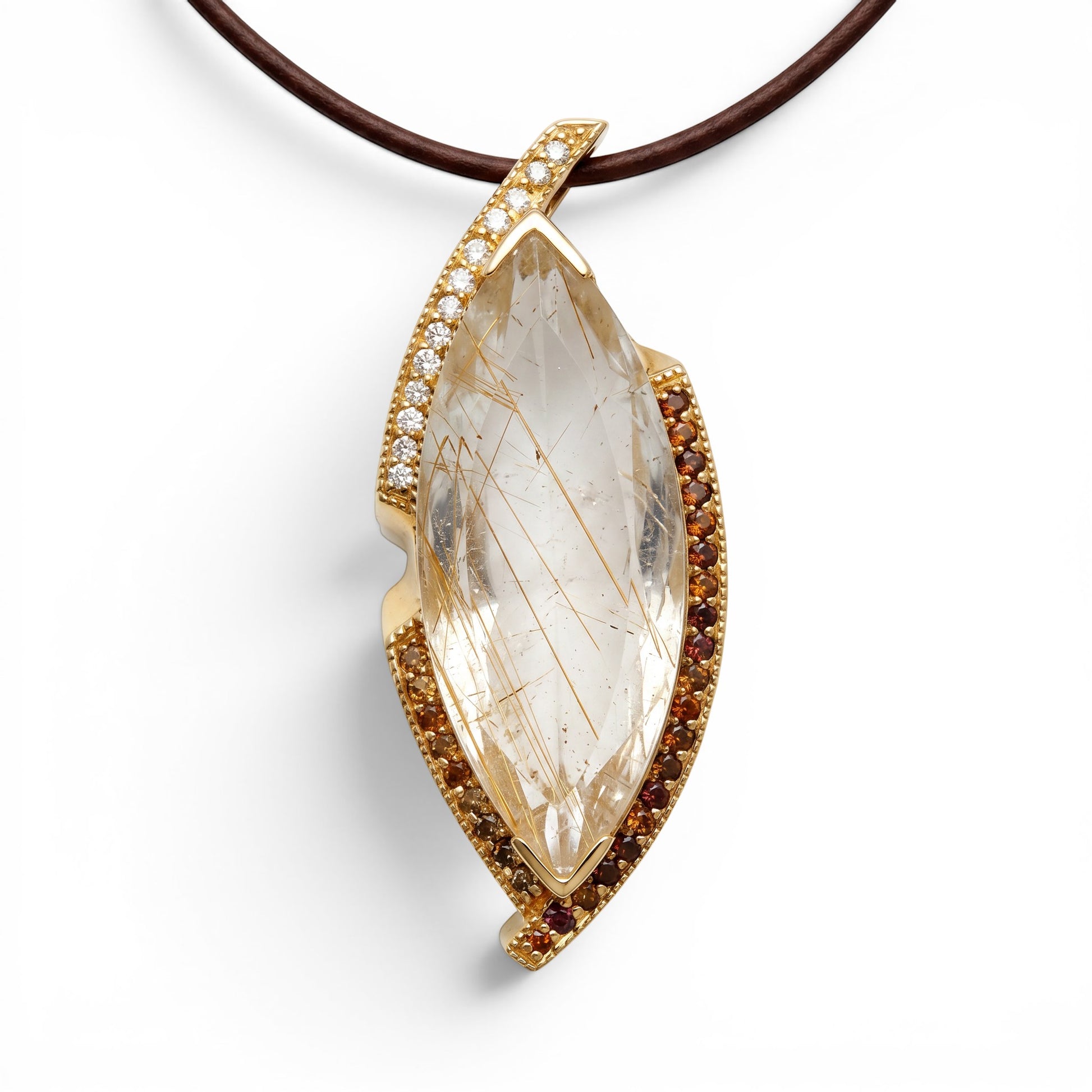 Trebor Style 14k gold pendant featuring a 27ctw rutilated quartz, diamond accents, and garnet stones.