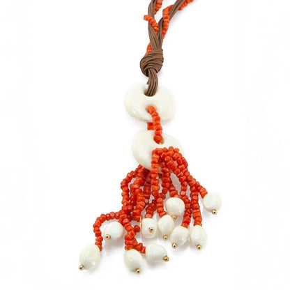 Trebor Style Sciacca coral and white coral tassel pendant necklace on a brown cord with button closure.