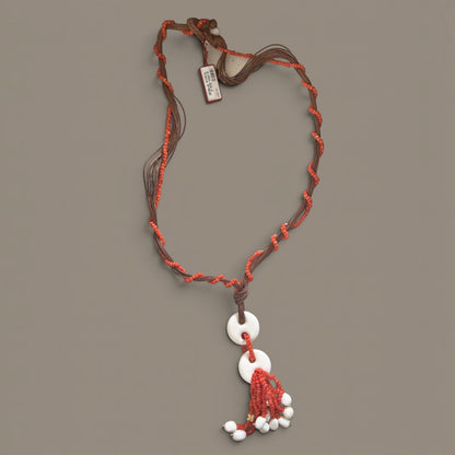 Trebor Style Rajola long cord necklace with Sciacca coral beads and white coral pendant tassel, made in Italy.