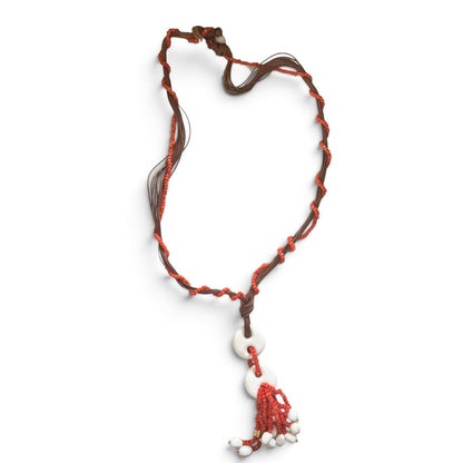 Trebor Style Rajola long cord necklace featuring Sciacca coral beads and white coral pendant tassel in a display box.