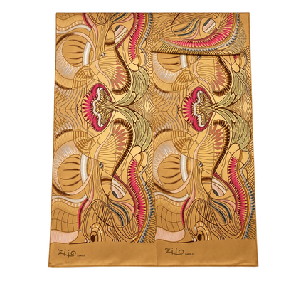 Trebor Style Ziio silk satin tube scarf featuring a gold and beige jungle print with pink and blue accents.