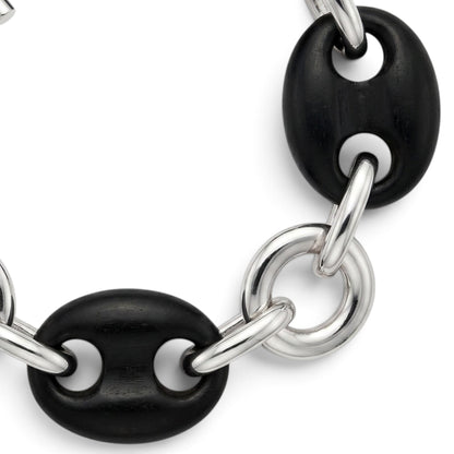 Trebor Style sterling silver and black ebony wood link bracelet with a toggle clasp on a white background.