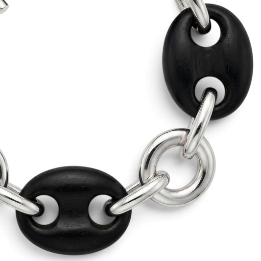 Trebor Style sterling silver and black ebony wood link bracelet with a toggle clasp on a white background.