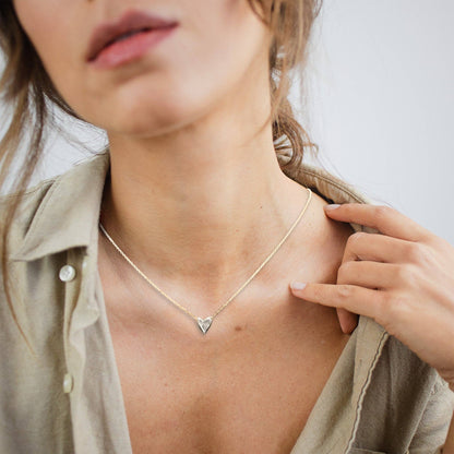 Trebor Style dainty heart necklace featuring a recycled sterling silver heart pendant on a 14kt gold-filled chain.