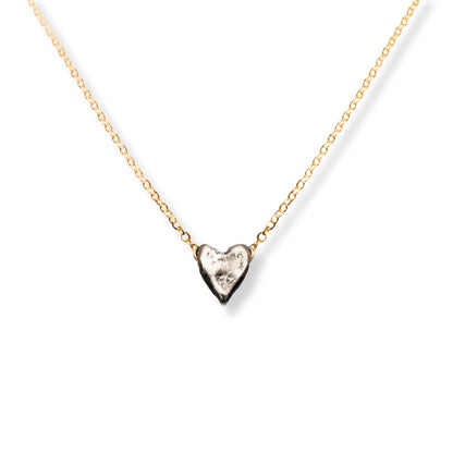 Trebor Style dainty heart necklace featuring a recycled sterling silver heart pendant on a 14kt gold-filled chain.
