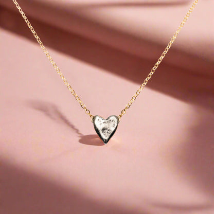 Trebor Style dainty heart necklace featuring a recycled sterling silver heart pendant on a 14kt gold-filled chain.