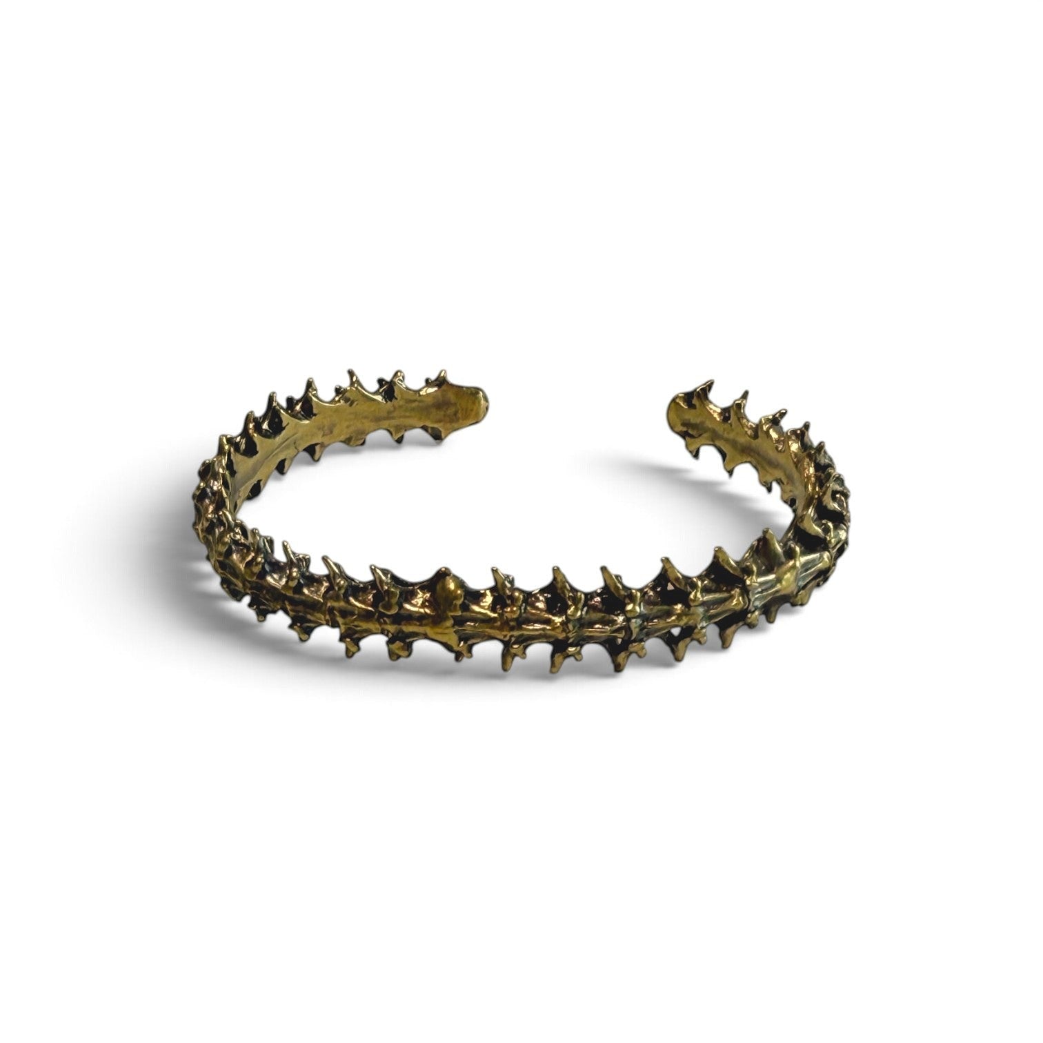 Trebor Style snake vertebrae bangle crafted from reclaimed copper and zinc in a dark metallic finish.