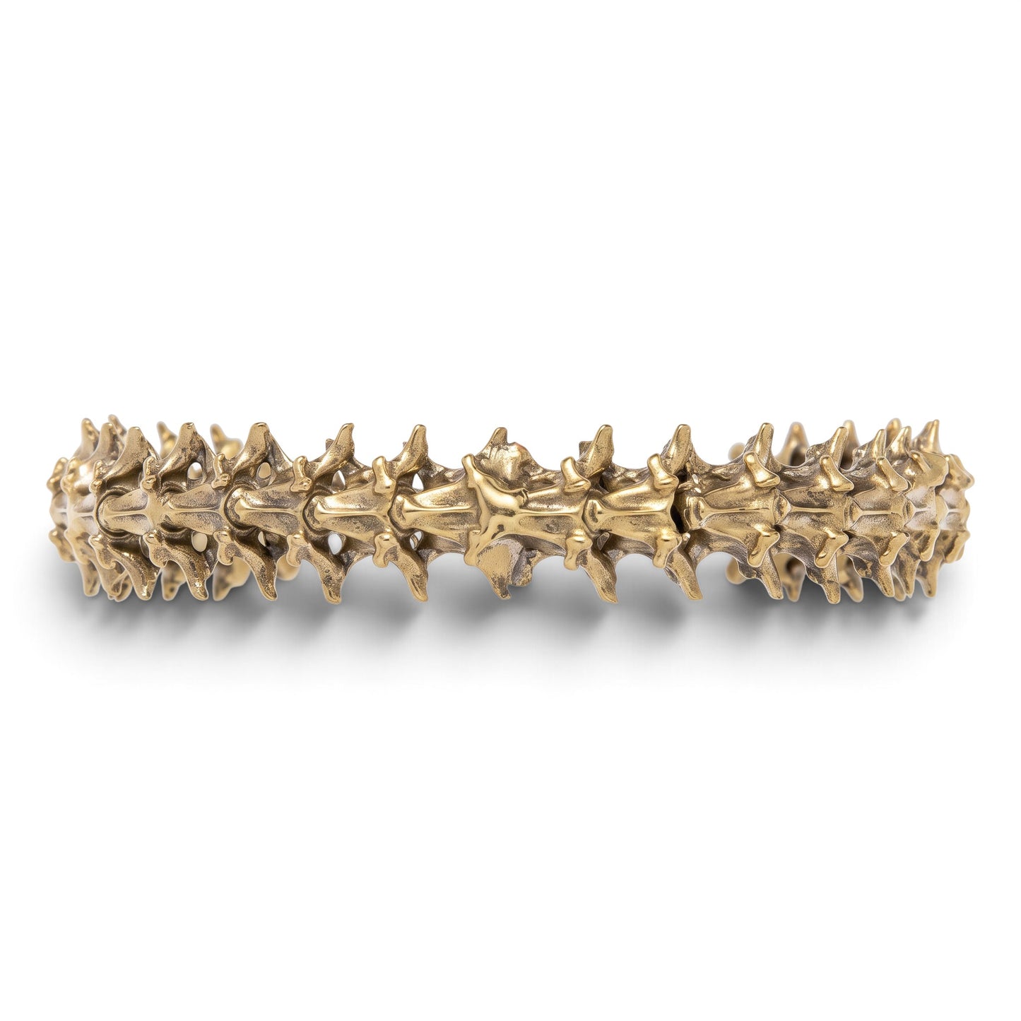 Trebor Style snake vertebrae bangle crafted from reclaimed copper and zinc in a textured, organic metallic finish.