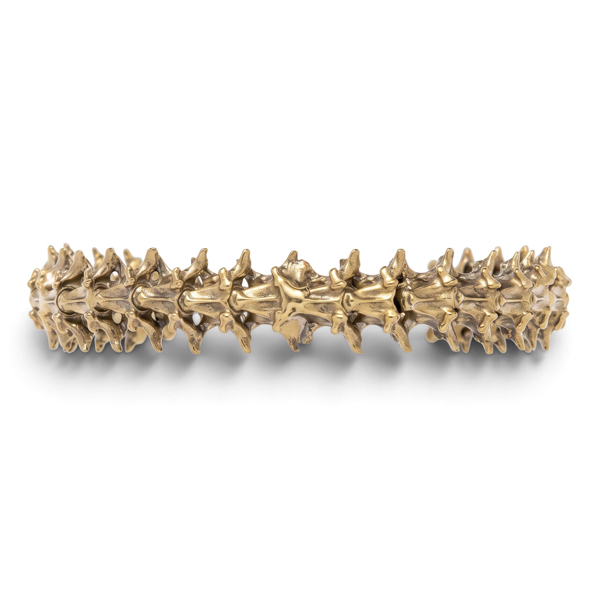 Trebor Style snake vertebrae bangle crafted from reclaimed copper and zinc in a textured, organic metallic finish.