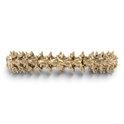 Trebor Style snake vertebrae bangle crafted from reclaimed copper and zinc in a textured, organic metallic finish.
