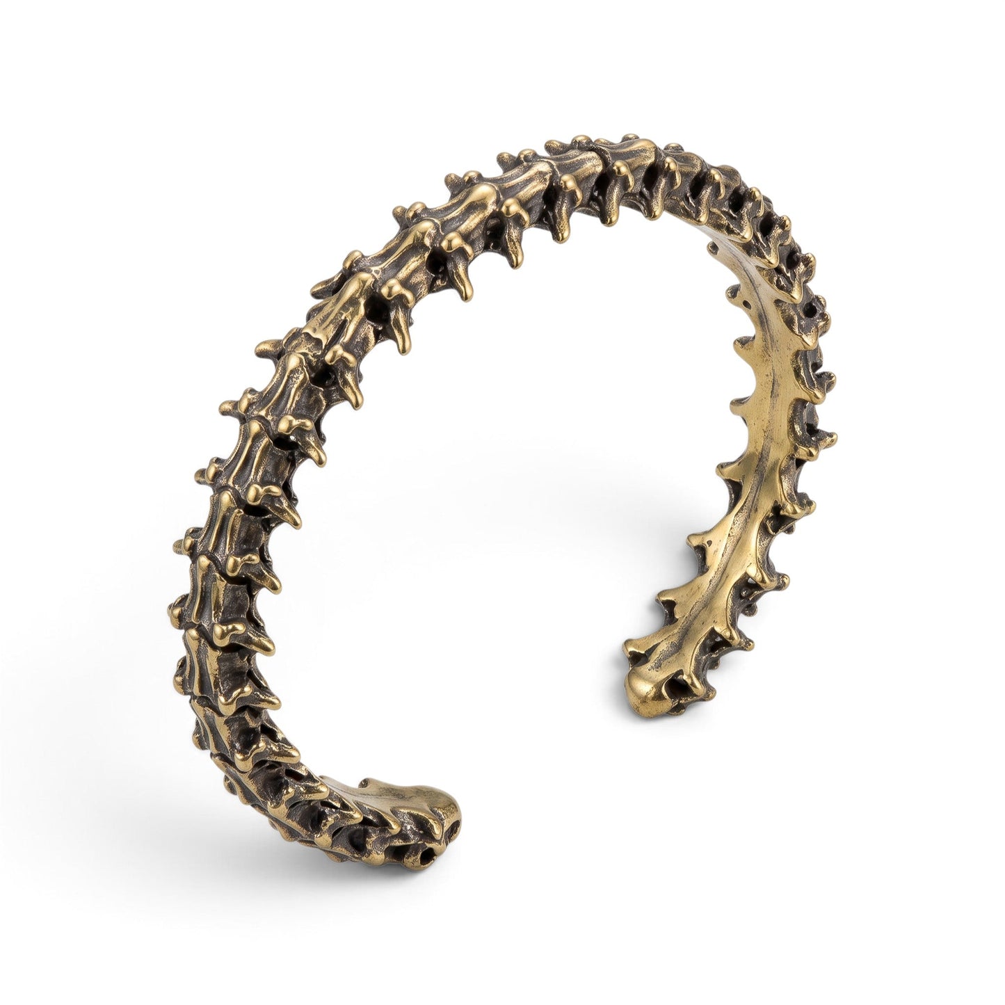 Trebor Style snake vertebrae bangle cast in reclaimed bronze-toned metal with a textured, organic bone-like design.
