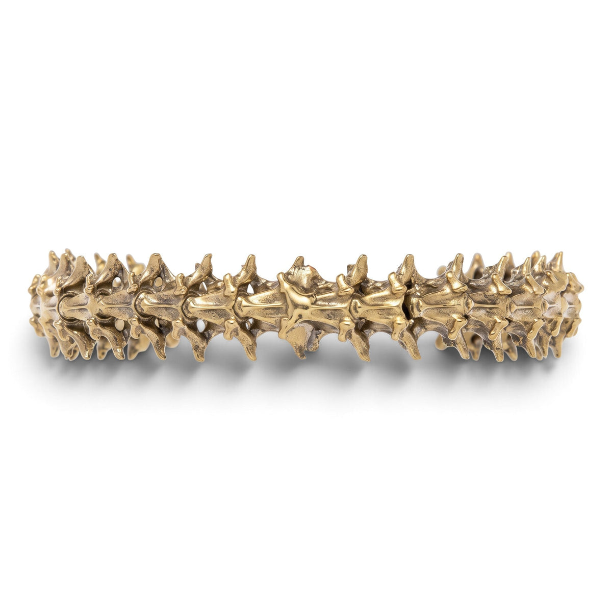 Trebor Style snake vertebrae bangle crafted from reclaimed copper and zinc in a textured, organic metallic finish.
