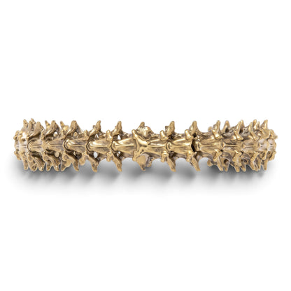 Trebor Style snake vertebrae bangle crafted from reclaimed copper and zinc in a textured, organic metallic finish.