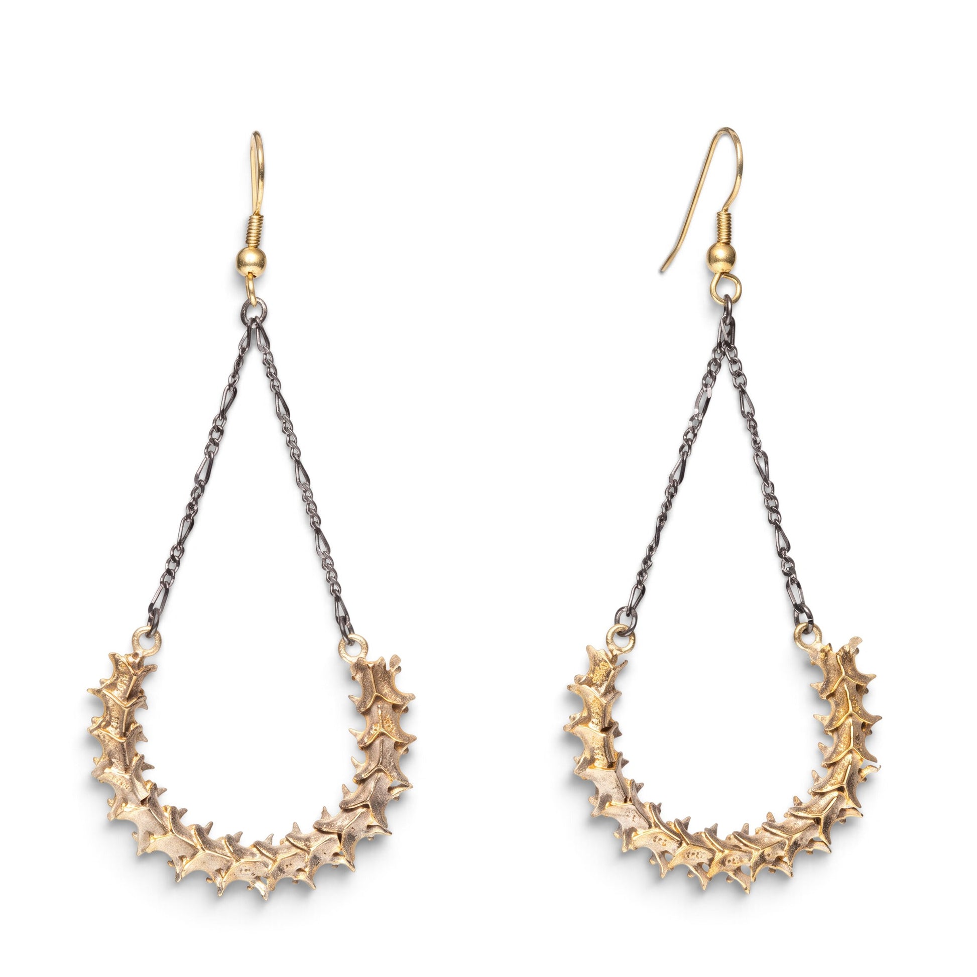 Trebor Style handmade snake vertebrae earrings with vintage chain and brass French hooks on a white background.
